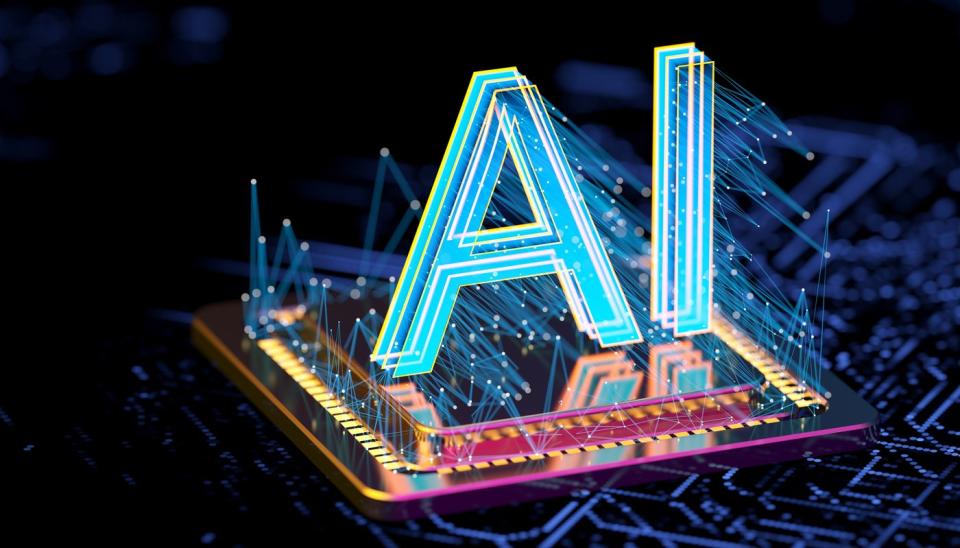 A hologram of the letters AI projected onto a computer chip.